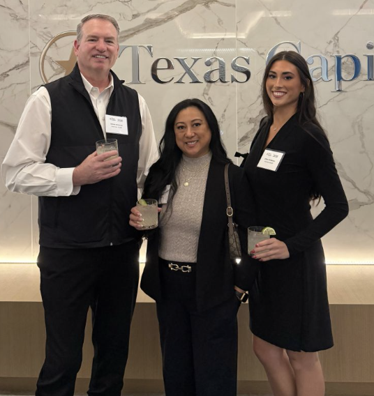 Ankerstar Wealth team members in front of the Texas Capital sign.